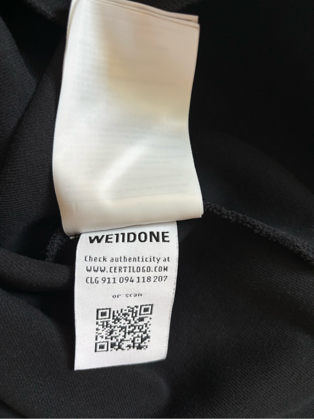 Men's Black V-Neck Sweater with White Geometric Accents - Picture 6 of 7